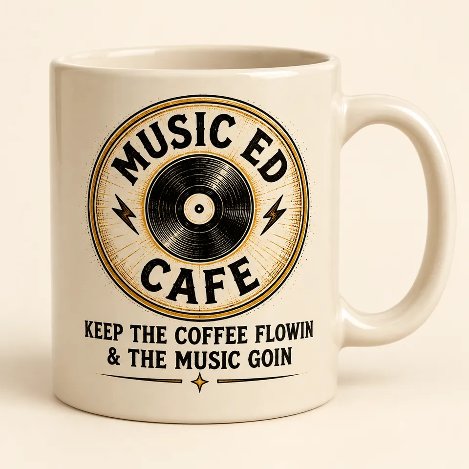 Mockup of a cream ceramic mug printed with the Music Ed Cafe record badge and the words Keep the Coffee Flowin and the Music Goin