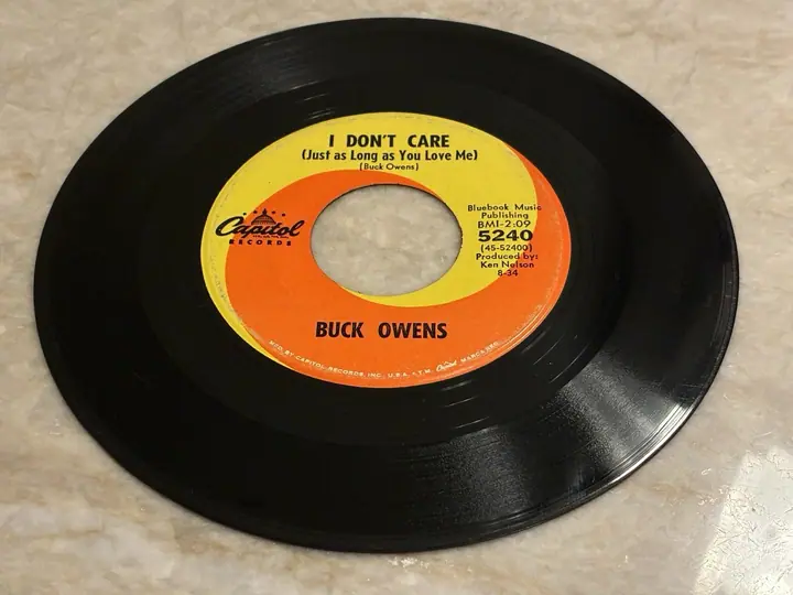 Buck Owens – I Don’t Care/Don’t Let Her Know record sleeve